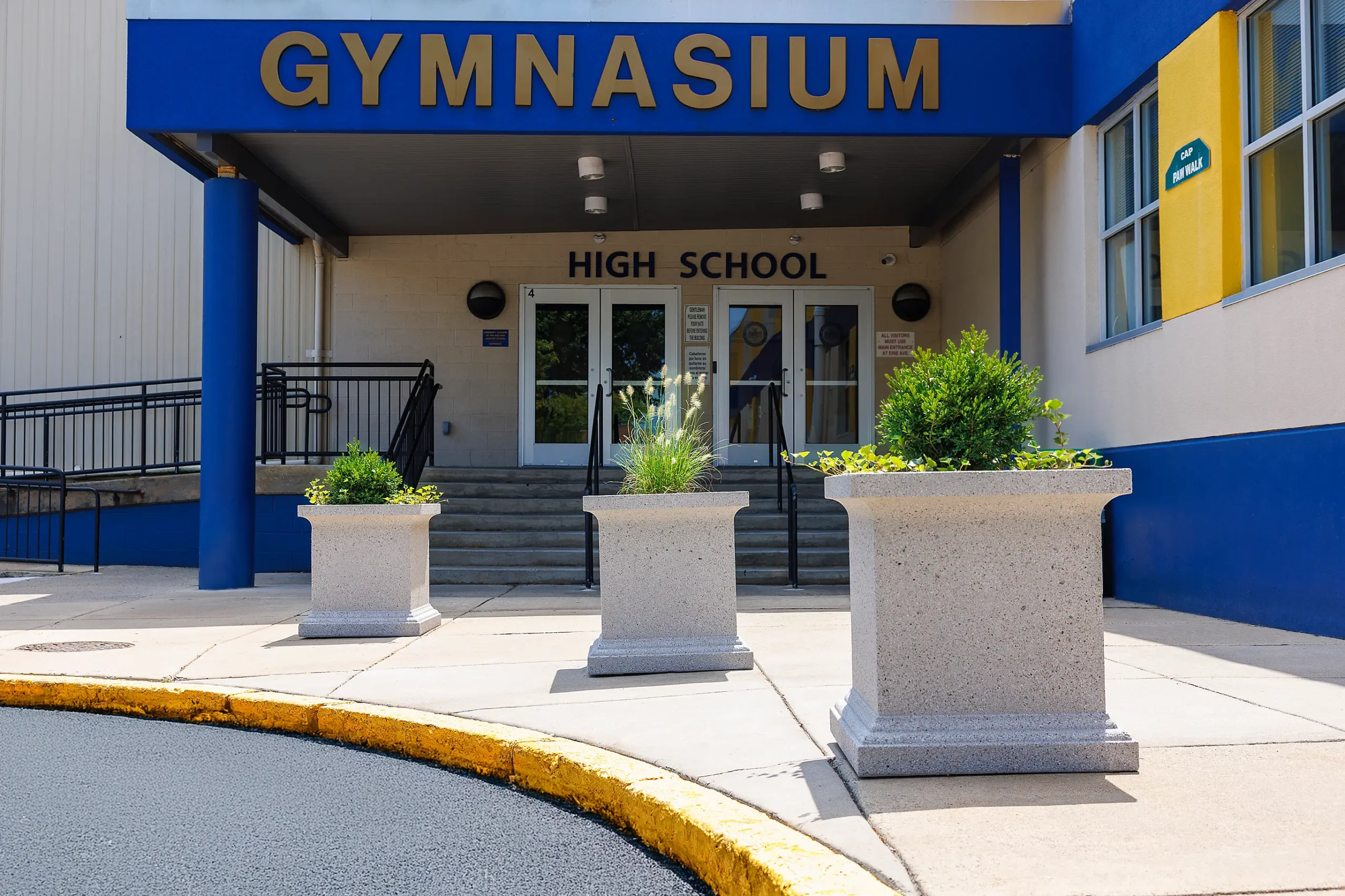 Planters enhance pedestrian safety at the Community Academy of Philadelphia high school entrance.